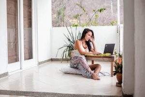 picture of a woman with female infertility doing her own research online for fertility FAQ