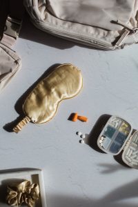 picture of a sleep mask and vitamins, minerals and melatonin for fertility