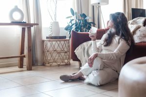 picture of a woman on a couch pondering fertility over 40