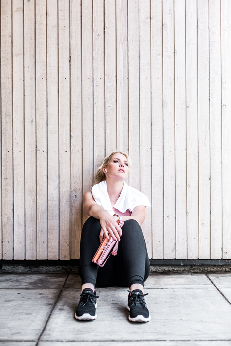 picture of a stressed woman, wondering about how stress affects fertility or if stress causes infertility