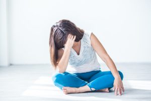 picture of a woman sitting cross-legged with POI or premature ovarian insufficiency or premature ovarian failure looking for natural treatment