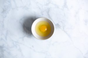 picture of an egg in a bowl to signify that naturopathic treatment can help improve egg quality in IVF preparation